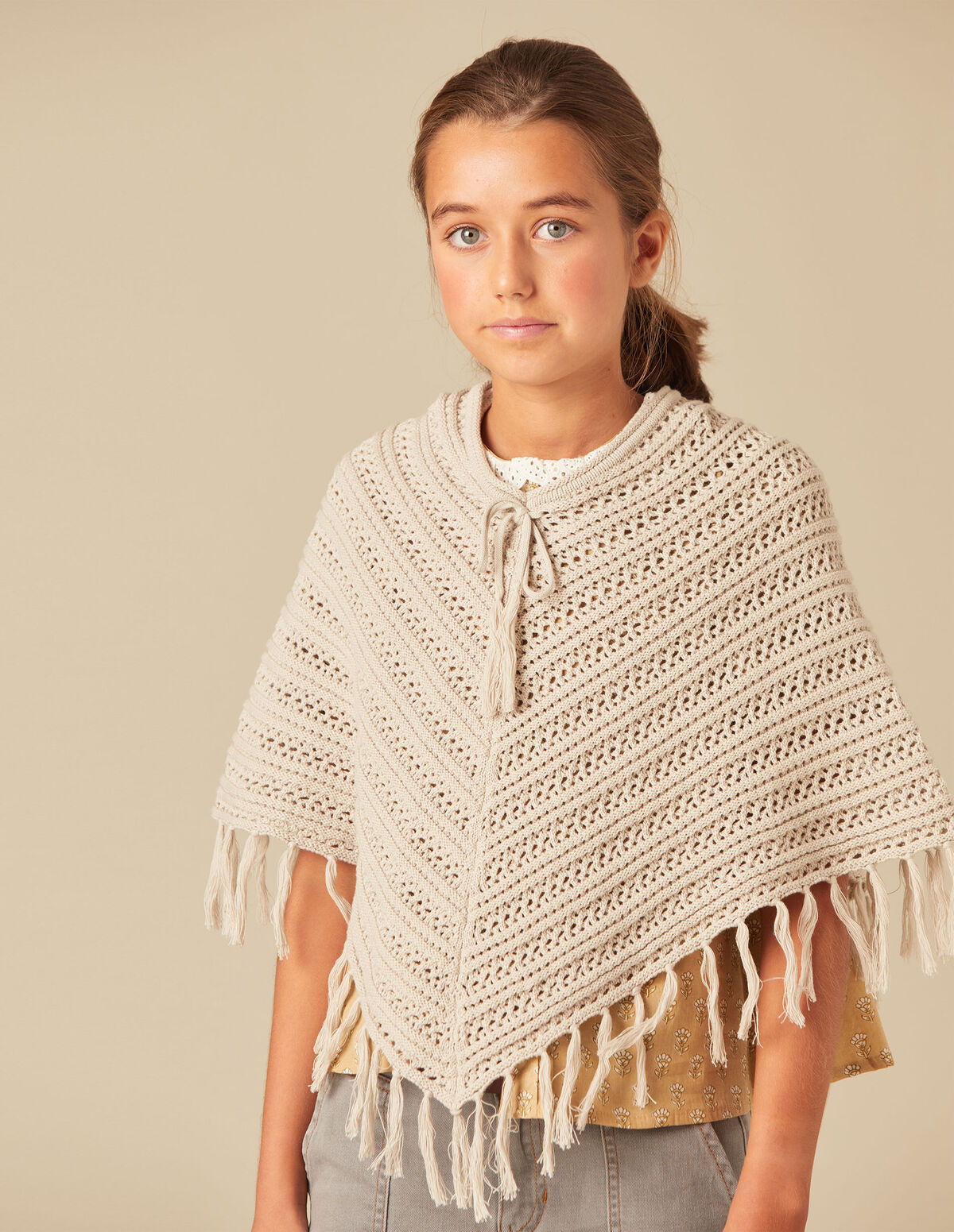 FRINGED KNIT PONCHO
