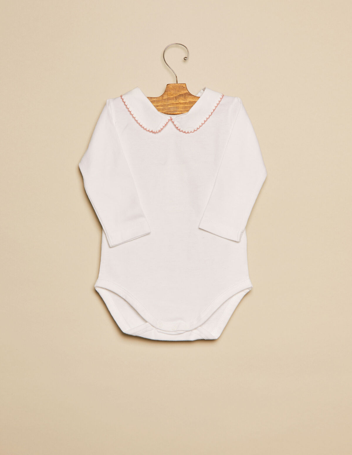 Body cuello beb&eacute; pespuntes rosa