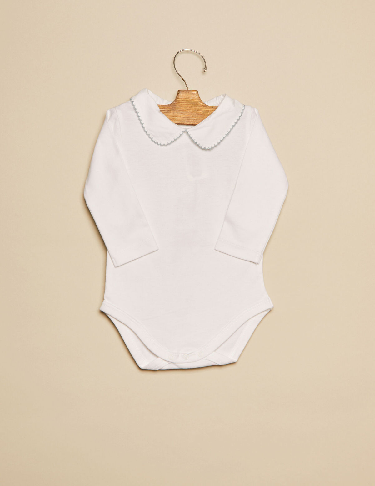 Body cuello bebé pespuntes rosa