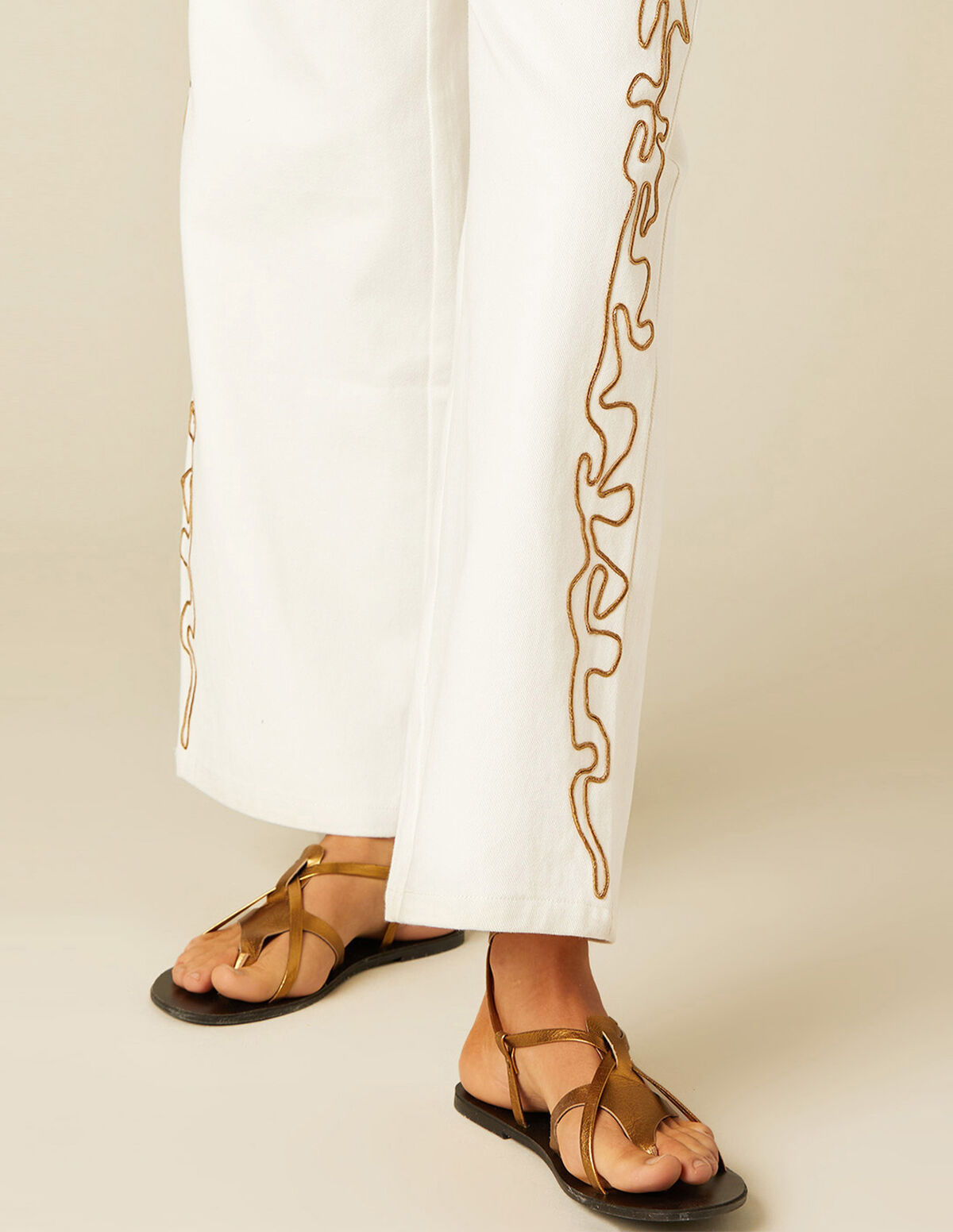 WHITE TROUSERS WITH EMBROIDERED BANDS