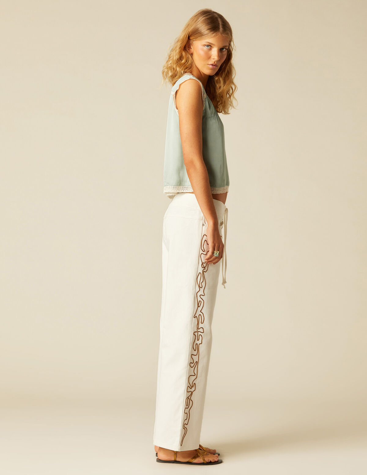 WHITE TROUSERS WITH EMBROIDERED BANDS
