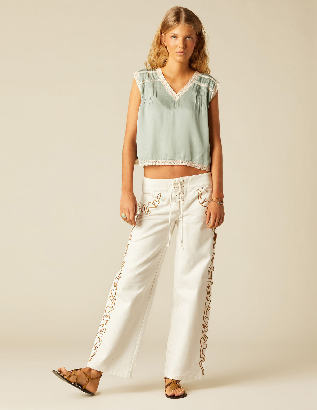 WHITE TROUSERS WITH EMBROIDERED BANDS